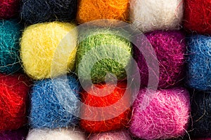 Geometric background with balls of colored synthetic wool