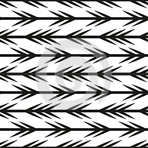 Geometric black and white pattern featuring repeated arrow designs