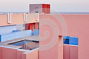 Geometric building swimming pool. Red wall, La manzanera. Calpe photo