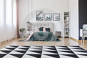 Geometric carpet in bedroom interior