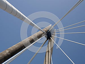 Geometric close up of the supports and cables of the suspension bridge in southport merseyside against a blue sky