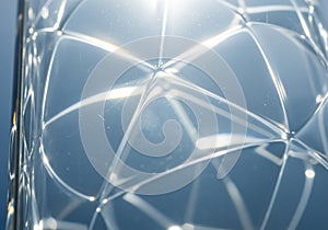 Geometric close-up of a transparent glass surface with triangular patterns creating a