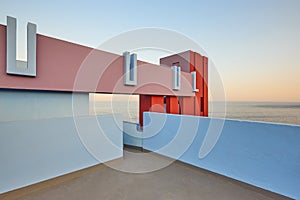 Geometric colored building design. The red wall, La manzanera. Calpe photo