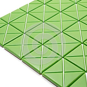 Green triangle pattern isolated on white background photo