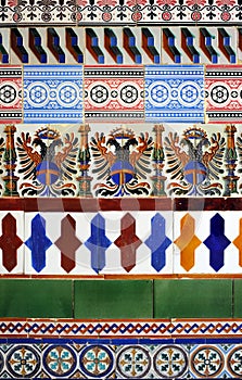 Geometric and historicist composition with old colorful tiles made in Seville, Spain