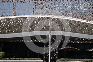 Mashrabiya screen pattern in metal panel over a building