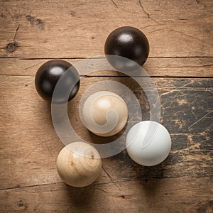Geometric objects. Wooden spheres on scratched wooden background