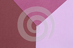 Geometric paper background from purple and pink. Copy space, place for your text. Top view