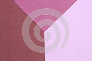 Geometric paper background from purple and pink. Copy space, place for your text. Top view