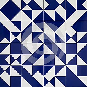 Geometric pattern featuring blue and white tiles arranged in a repetitive design. Each