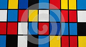 Geometric pattern featuring a grid of rectangles in primary colors: red, blue, yello