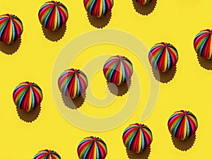 Geometric pattern of  Rainbow Sphere on a bright yellow background, top view