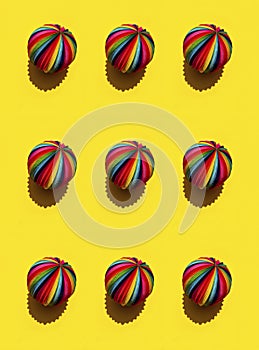 Geometric pattern of  Rainbow Sphere on a bright yellow background, top view