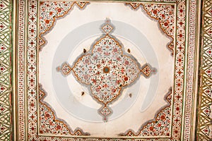 Geometric patterns on the ceiling of an old building in Indian style