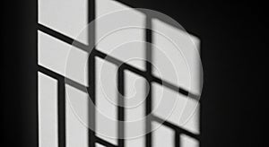 Geometric patterns of light and shadow form on a wall, likely from a window with a