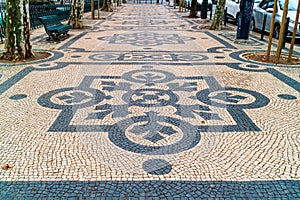 Geometric patterns of public walkways in Lisbon.