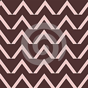 Geometric pink triangles on brown background seameless pattern.