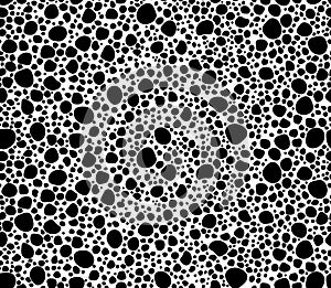 Geometric seamless pattern with black polka dots of small and large scale. Monochrome texture with scattered, random circles shape