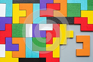 Geometric shape block with colorful wood puzzle piece background. logical thinking, business logic, Conundrum, decision, solutions