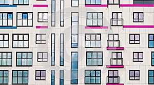 Geometric shapes. The facade of a modern residential building. Windows, wall, reflections