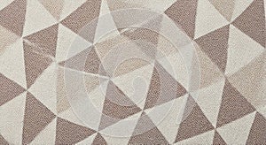 Geometric textile pattern with interlocking triangles in neutral beige and brown tones