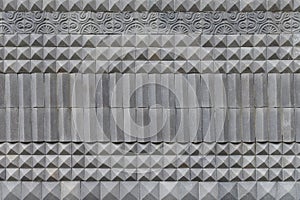 Geometric texture of gray concrete fence