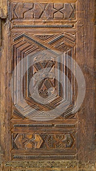 Geometrical and floral engraved patterns of Mamluk style wooden ornate door leaf