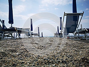 Geometries of umbrellas and deckchairs on the Italian beaches photo
