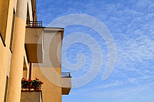 Geometry of building. Old concrete wall at sky background. Abstract architecture.