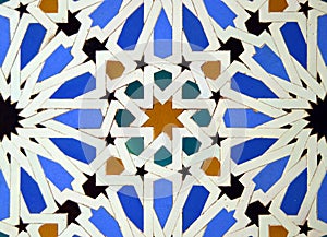 Geometry and colour. Al Andalus tiling -alicatados- in the Alcazar of Seville, Andalusia, Spain. Tiles of Al Andalus