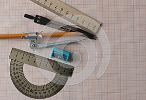 Geometry set with compass,pencil,ruler on graph paper