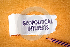 GEOPOLITICAL INTERESTS. Purple pencil and orange paper photo