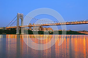 George Washington Bridge with NYC skyline at dusk