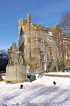 Georgetown University campus square with statue of its founder in Washington DC, USA.