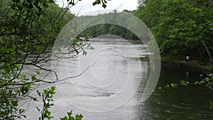 Georgia, Buford dam park, looking downstream at the Chattahoochee River with fishermen on shore