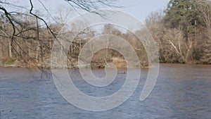 Georgia Chattahoochee River Park 6K Pan left to right on the Chattahoochee River with trees