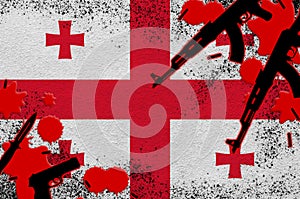 Georgia flag and guns in red blood. Concept for terror attack and military operations