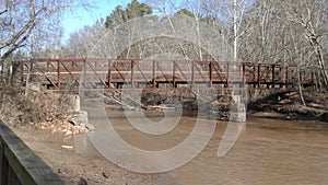 Georgia, Olde Rope Mill Rd Park, side view of little river bridge with flowing water