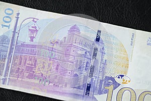 Georgian banknote in one hundred lari on a dark background