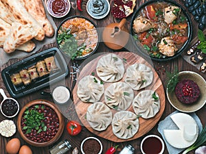 Georgian cuisine on wooden table, top view