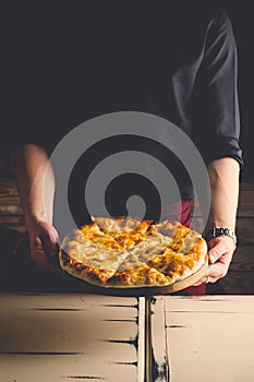 Georgian dish, khachapuri in the hands