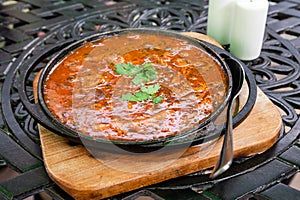 Georgian dish Ostri stewed pieces of beef in pan