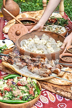 Georgian food Caucasian shashlik khinkali salad Dinner table