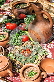 Georgian food Lobio vegetables herbs Dinner table