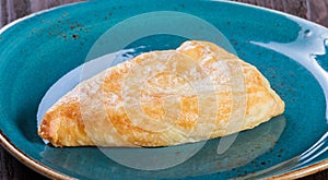 Georgian khachapuri flatbread or flat cake with cheese on a plate Homemade baking.