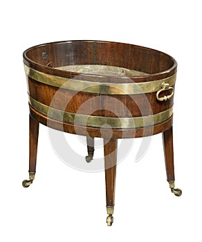 A Georgian mahogany wine cooler having brass banding and drop handles to the sides, raised on casters