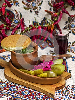 Georgian traditional food Lobio or kidney and haricot beans soup with picked vegetables and red wine