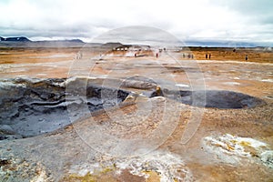 Geothermal field Namaskard, Iceland. Desolate landscape with mud volcano and hot steam.