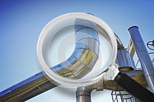 Geothermal stainless steel power pipe structure of a geothermal power station against a sky background - Concept image seen