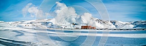Geothermic energy plant over the snow, panorama photo